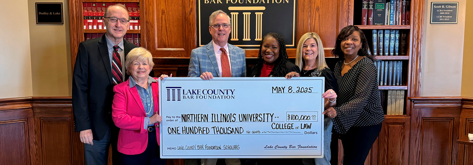 College of Law administrators accept check from Lake County Bar Foundation